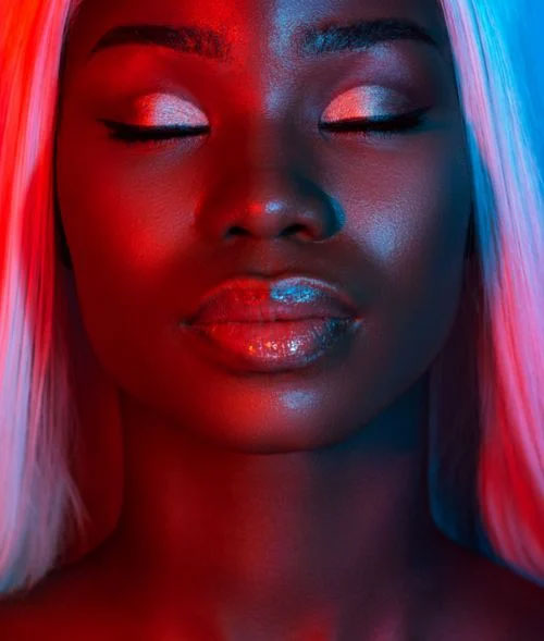 A women in atmospheric lighting with eye makeup