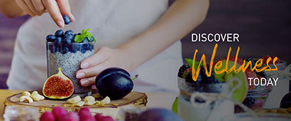 A chef adding berries to a fig yoghurt