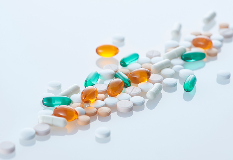 Assorted tablets on a blue background