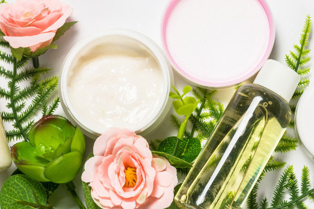 Pots of personal care products with flowers