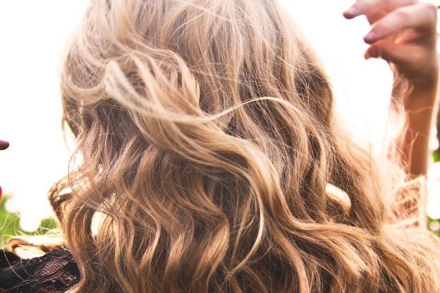 A woman with healthy shiny wavy hair