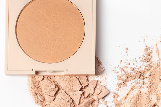 A makeup compact with cosmetic powder