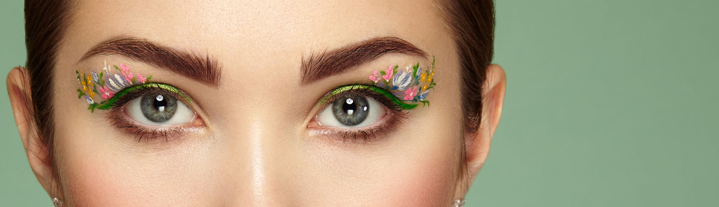 Close up of a womans eyes with flower eye makeup