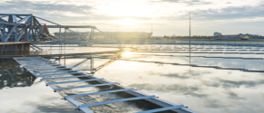 Sunrise over a water treatment facility